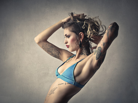 Beautiful woman wearing a light blue swimsuitの写真素材