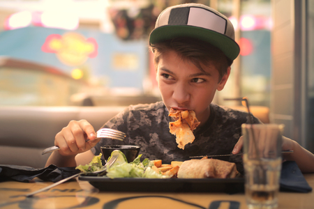 Kid eating his mealの写真素材