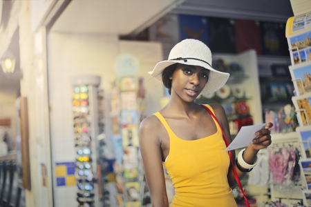 buying some postecardsの写真素材