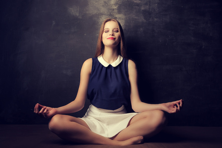 Meditating on the floorの写真素材