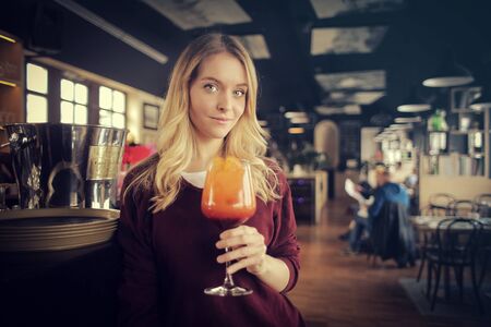 Drinking a colorful drinkの写真素材