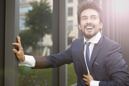 Happy businessman in a tieの写真素材