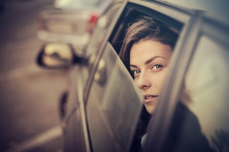 Girl is looking from the carの写真素材