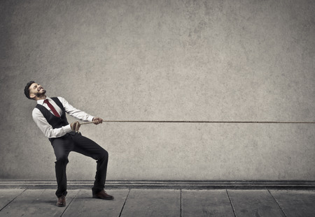 Businessman is pulling the rope