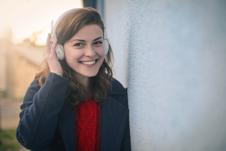 The girl is listening to music