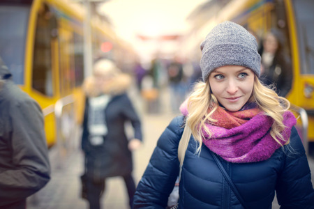 Young girl at the tram stationの写真素材