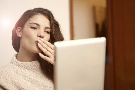 Woman is sending a kissの写真素材