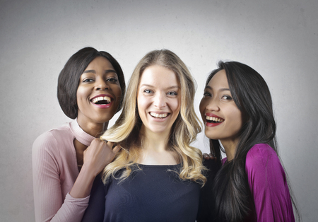 Three beautiful girls are smilingの写真素材