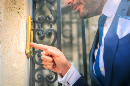 The businessman is ringing the bell