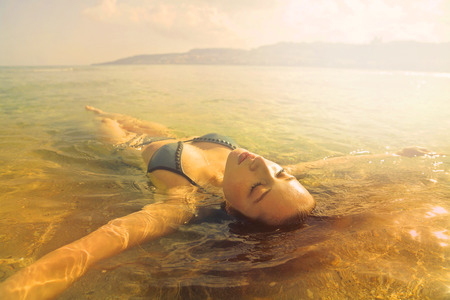 Woman is relaxing in the waterの写真素材