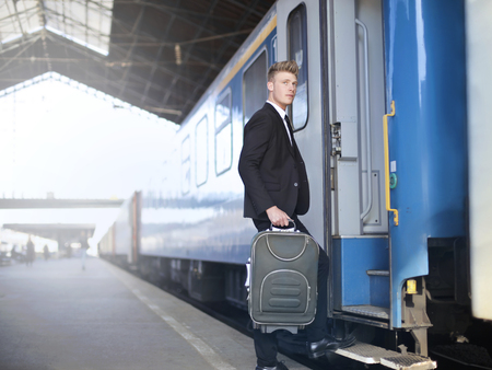 Businessman is traveling with trainの写真素材