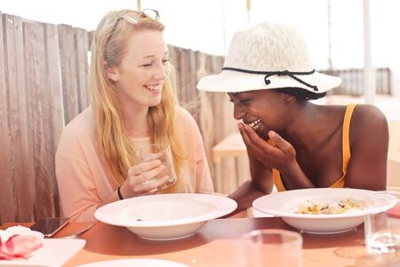 Girls are having fun at lunchの写真素材