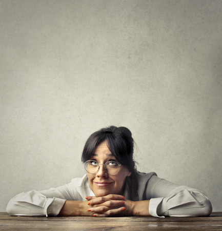 Businesswoman is resting on the desk