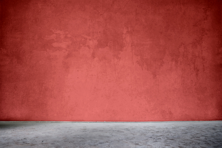 Red wall and gray floorの写真素材