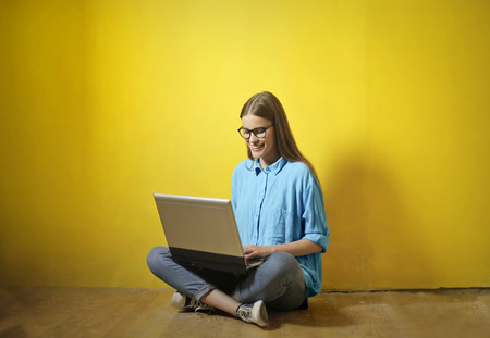 Girl using a laptopの写真素材