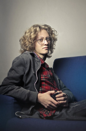 Guy sitting on a sofaの写真素材