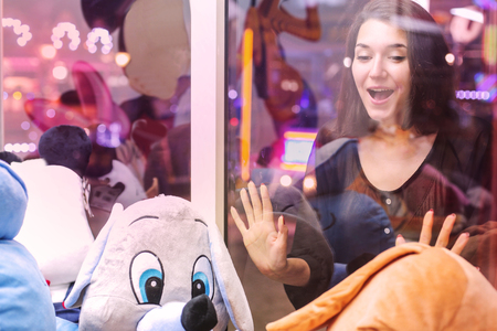 Girl looking at some puppetsの写真素材