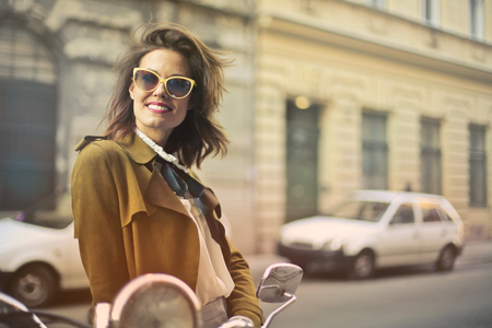 Smiling girl in a city streetの写真素材