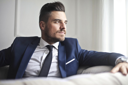 Elegant man on a sofaの写真素材
