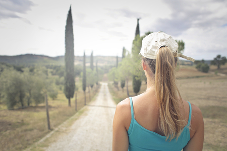 Girl walking in the countrysideの写真素材