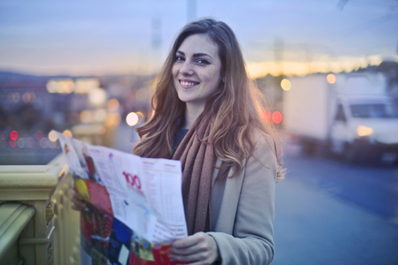 Smiling girl with a city mapの写真素材