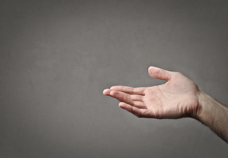 Detail of a hand with neutral backgroundの写真素材