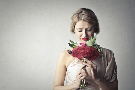 Portrait of a woman with a bouquetの写真素材