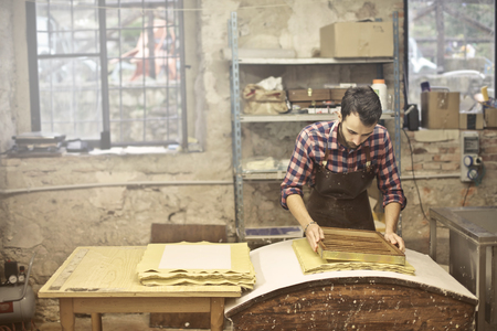 Young artisan at work in a laboratoryの写真素材