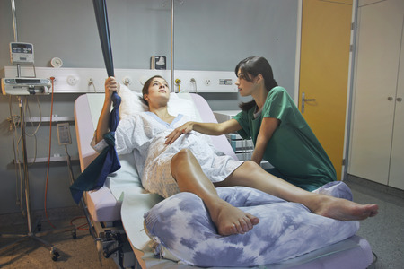 Pregnant woman in a hospital with a gynecologistの写真素材