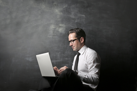 Businessman with a laptopの写真素材