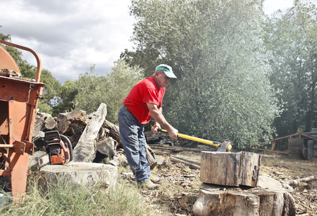 Man cutting wood with an axの写真素材