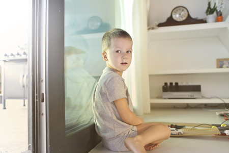 Child playing alone at homeの写真素材