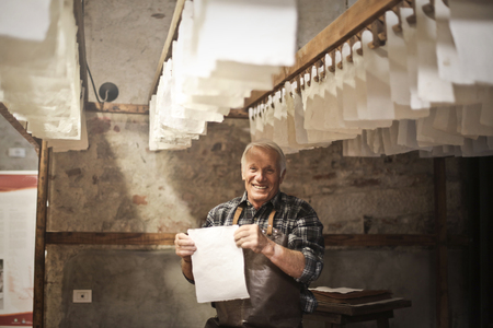 Aged artisan at work in a laboratory