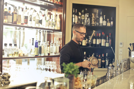 Barman preparing a drinkの写真素材