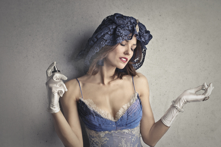 Elegant young woman with perfumeの写真素材