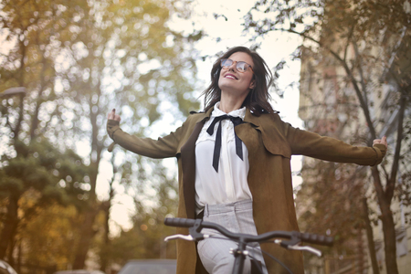Happy girl on a bikeの写真素材