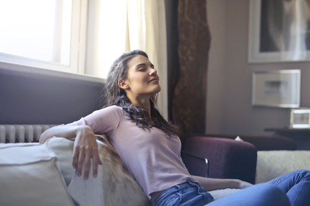 Girl in a living roomの写真素材