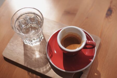Espresso coffee with red cup on wood table 4.の素材