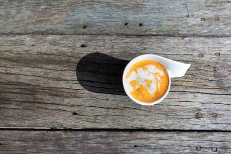 cup of coffee,milk tea in wooden table backgroundの写真素材