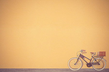 retro vintage bicycle old and brown wall background designの写真素材