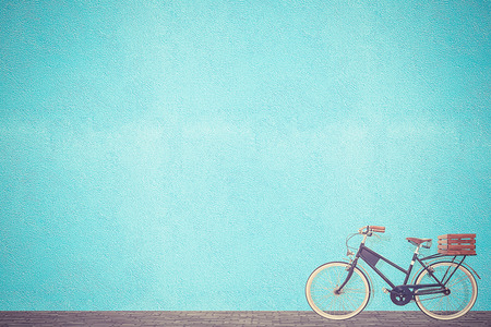 retro vintage bicycle old and blue wall background designの写真素材