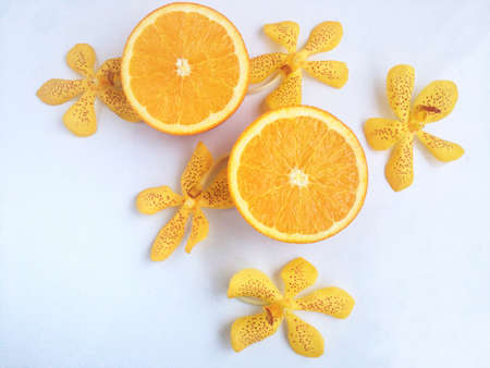 Fresh orange and slices on white background.