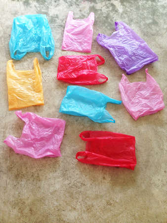 Colorful plastic bag on cement floorの写真素材