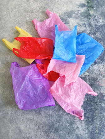 Colorful plastic bag on cement floorの写真素材