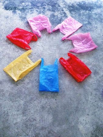 Colorful plastic bag on cement floorの写真素材