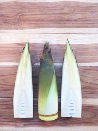Bamboo shoots  on wooden backgroundの写真素材