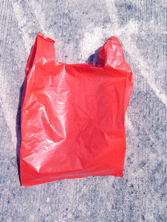 Colorful plastic bag on cement floorの写真素材