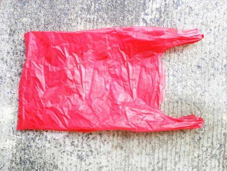 Colorful plastic bag on cement floor