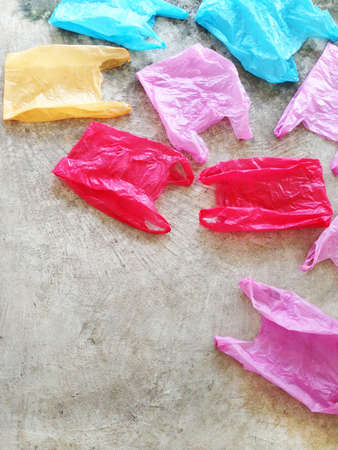 Colorful plastic bag on cement floorの写真素材