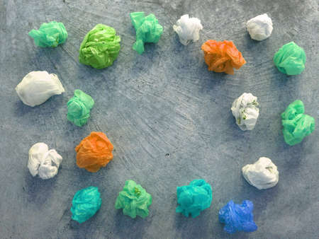 Colorful plastic bag on cement floor